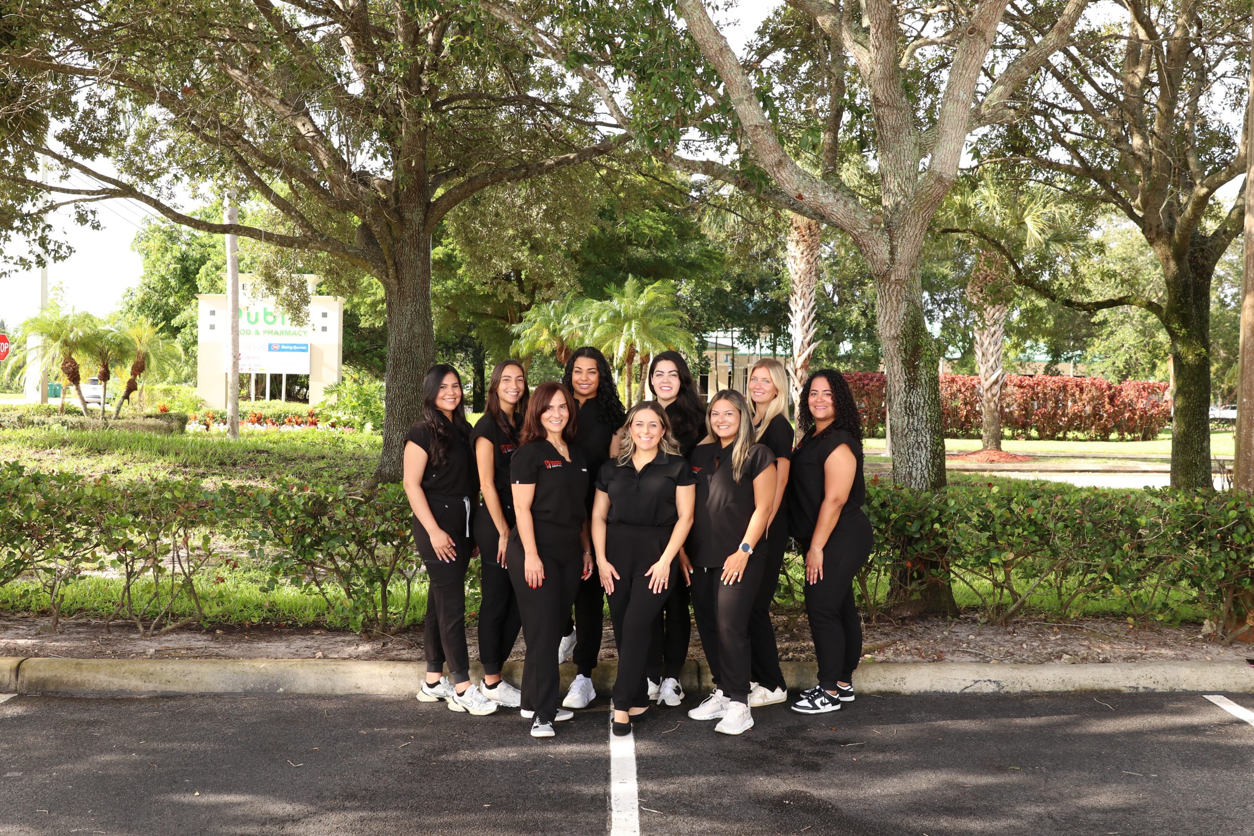 The Regency Square Dental front-office team at the reception desk.