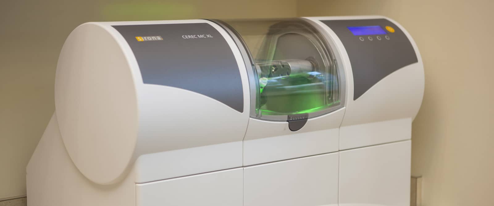 The in-house CEREC mill shaping a ceramic restoration at Regency Square Dental.