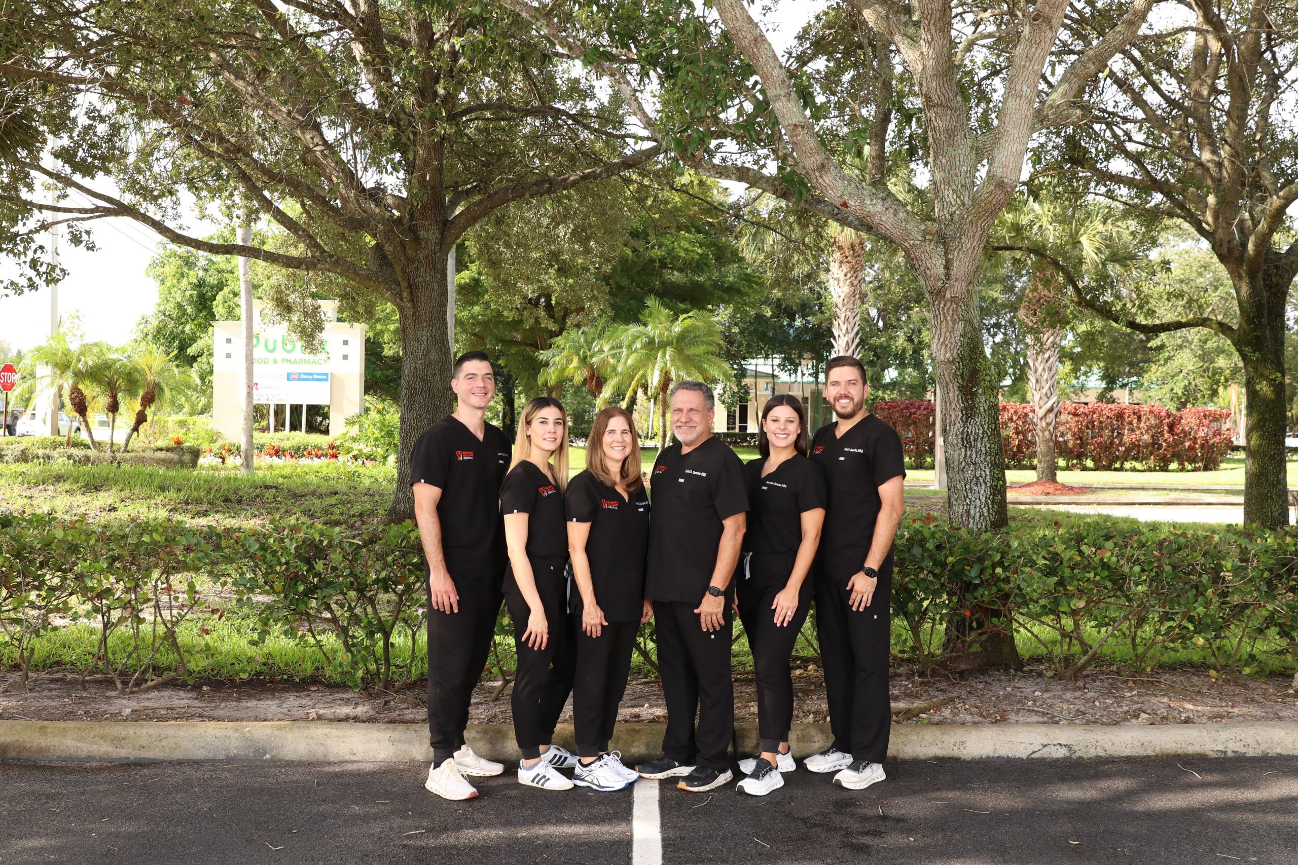 Regency Square Dental dentists standing together in white coats.